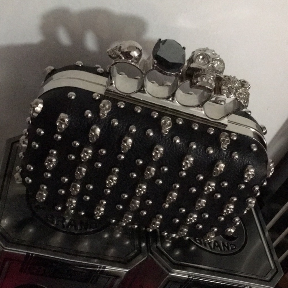 Brass knuckle skull clutch